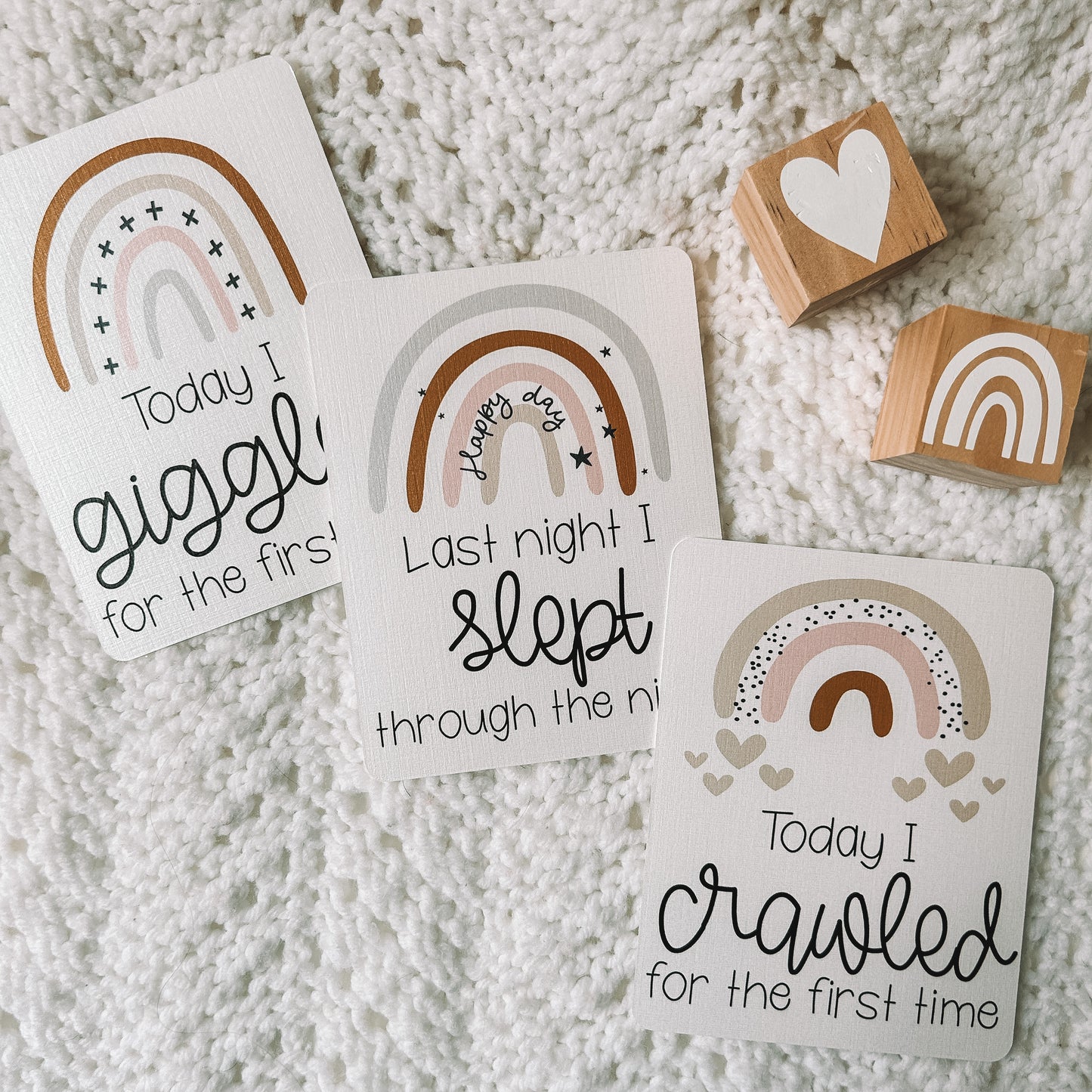 Today I giggled for the first time, last night I slept through the night, and today I crawled for the first time milestone cards with a rainbow above the text