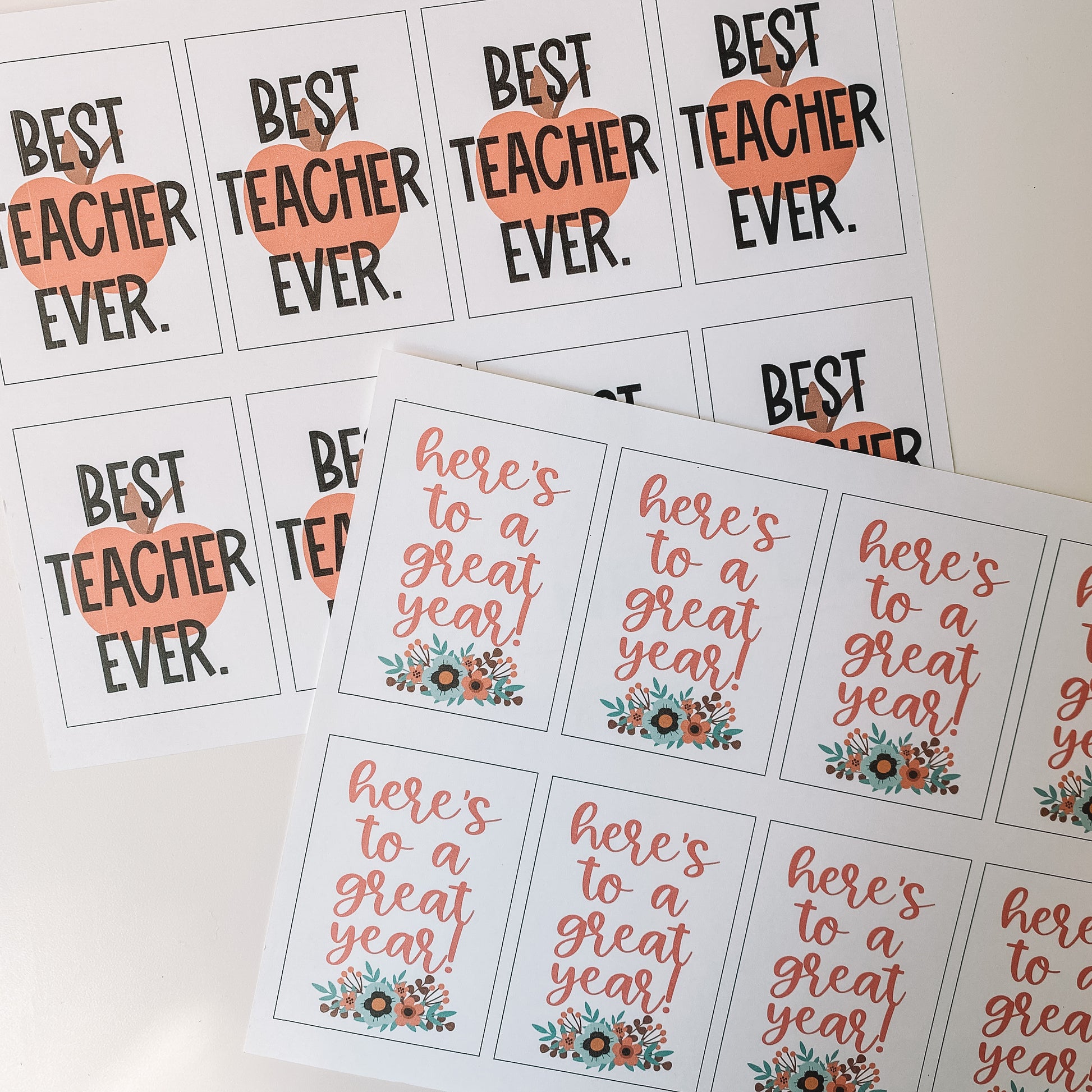 Best teacher ever and here is to a great year gift tags displayed on an 8.5 by 11 inch paper before cutting. There are eight of each tag printed on each page.