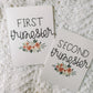 Two milestone cards with black text and a floral bouquet beneath the words first trimester and second trimester