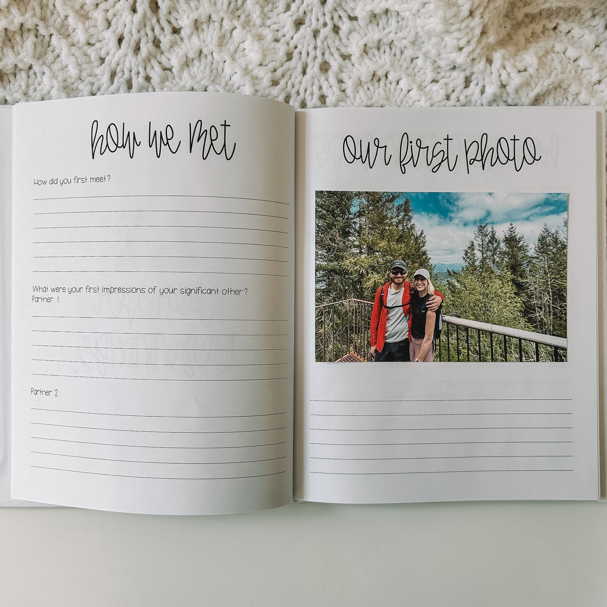 Two page spread in prompted engagement journal. Left page has questions about how we met and right page has a our first photo with blank lines