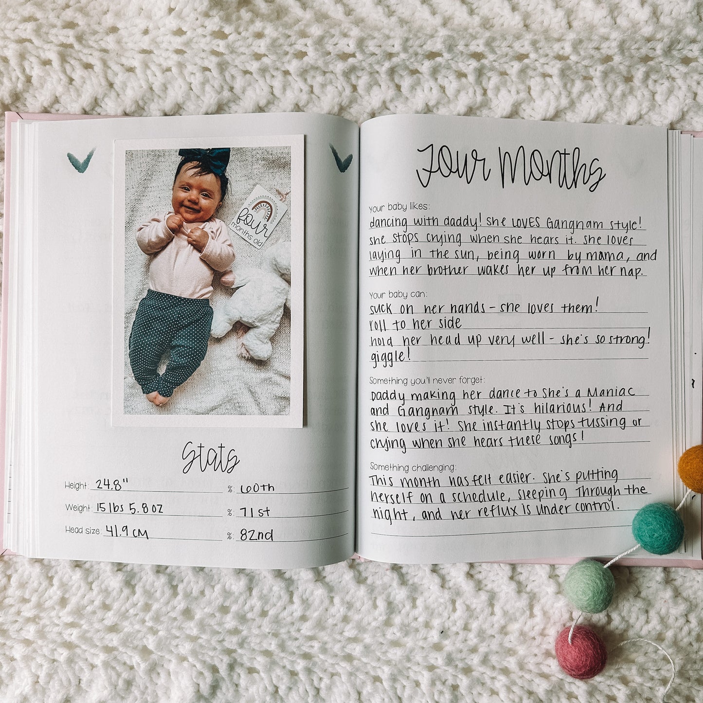 Two page spread with photo of baby on the left with stats underneath and the page on the right is titled four months with four prompts.