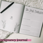 Two page spread features a space for photos or mementos on the left side and the right page is titled The First Trimester with four prompts.